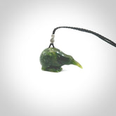 Hand carved Jade kiwi pendant for lovers of birds. Hand made kiwi necklace with black adjustable cord. Unique gifts and Art to Wear by NZ Pacific.